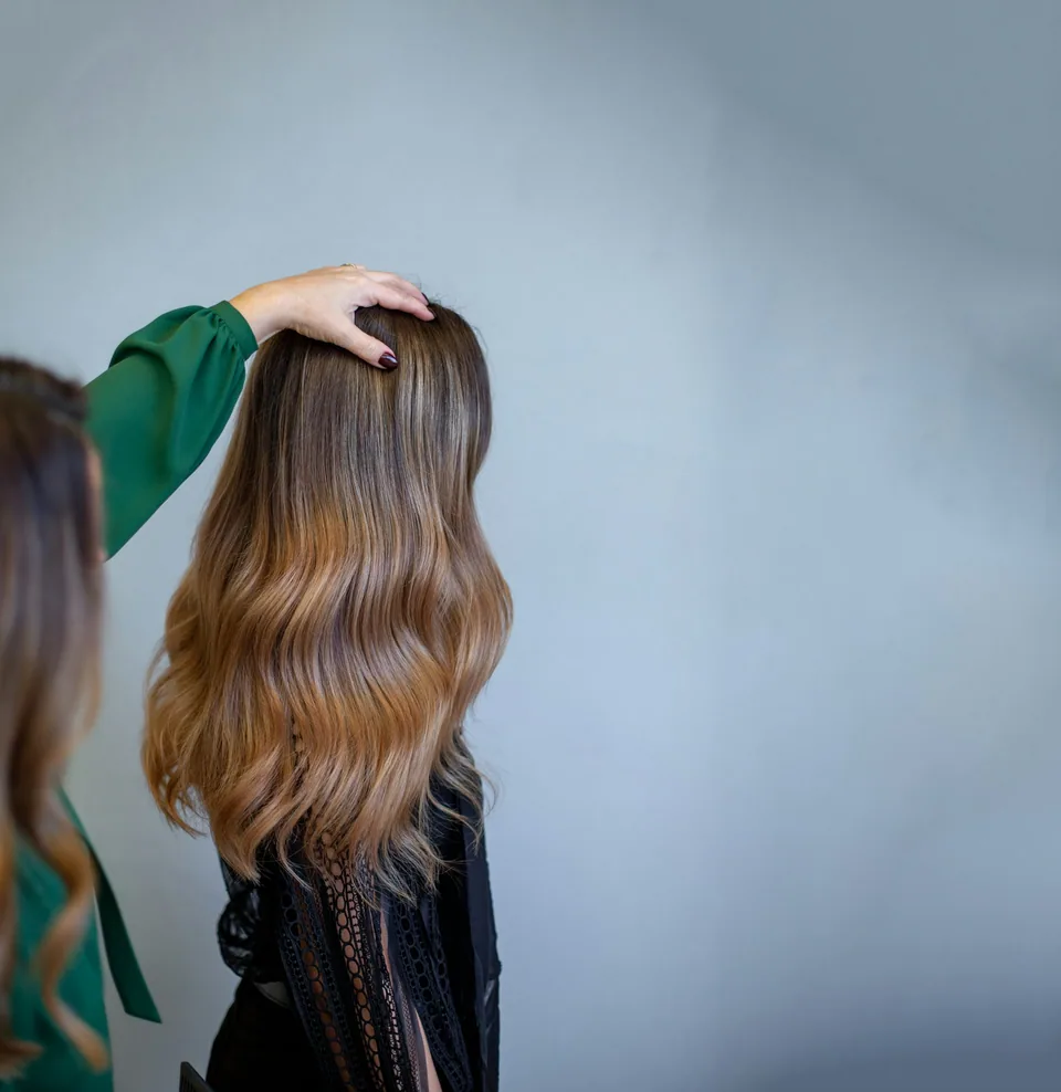 Beautifully blended balayage cascading in soft waves